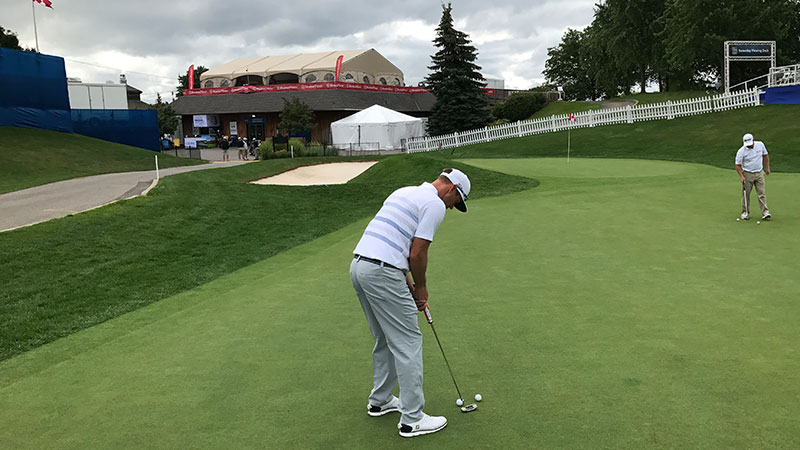 At work on the practice green.