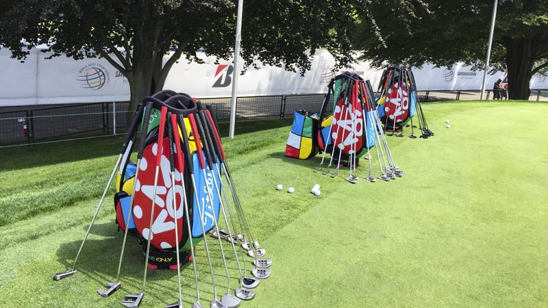 Our colorful Tour staff bags on the practice green in Akron.