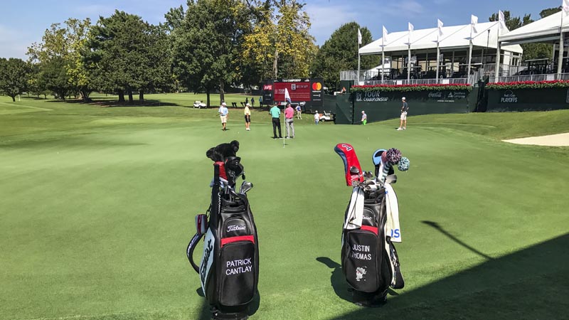 J.T. and Patrick Cantlay's staff bags during a practice round.