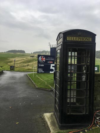 Traditional phone box at Close House GC, Newcastle-upon-Tyne, UK.