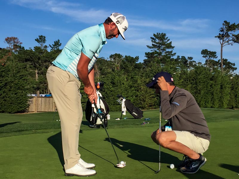 Scott Piercy working with his caddy Jose while rolling his Roundback.