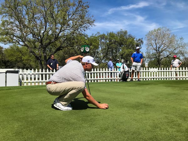 Patton Kizzire lining one up on the practice green.