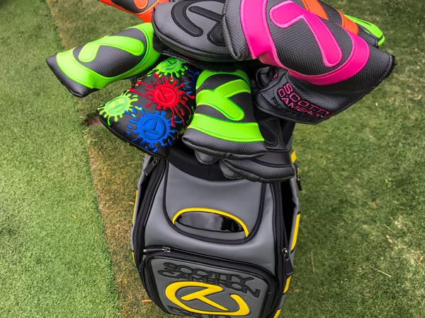 Our staff bag filled with colorful headcovers protecting our fine milled putters.