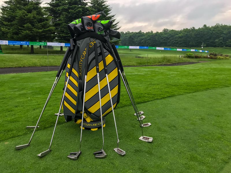 Our Caution Stripe staff bag on the practice green.