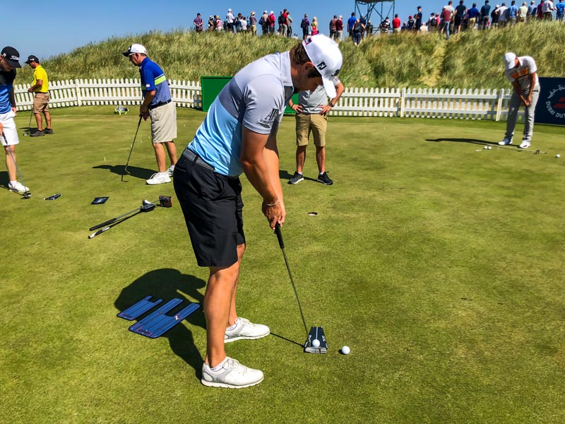 Peter Uihlein running some putts.