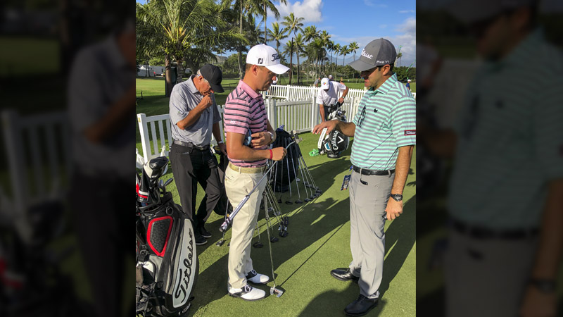 Justin Thomas taking a look at a new prototype mallet.