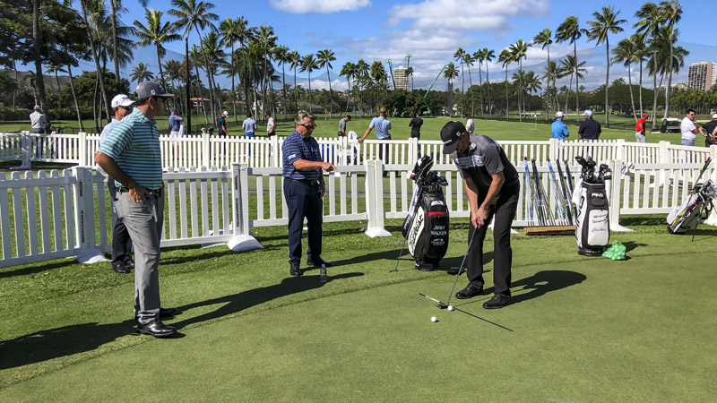 Scotty on the putting surface with Jimmy Walker.