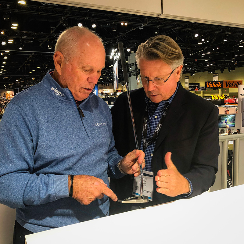 Scotty talking Phantom X putters with Butch Harmon.