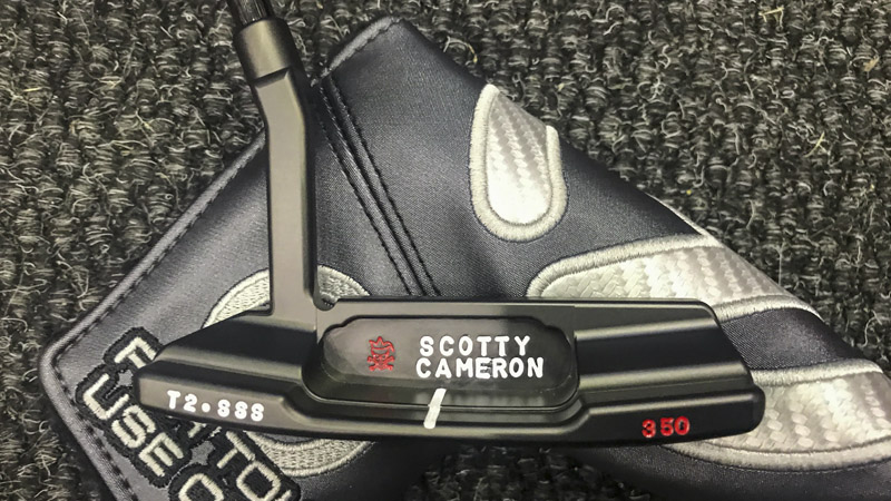 Timeless 2 in Tour Black with a hand-stamped Jester in the back cavity.