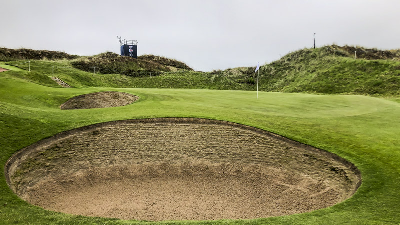 Deep bunkers and fast greens.