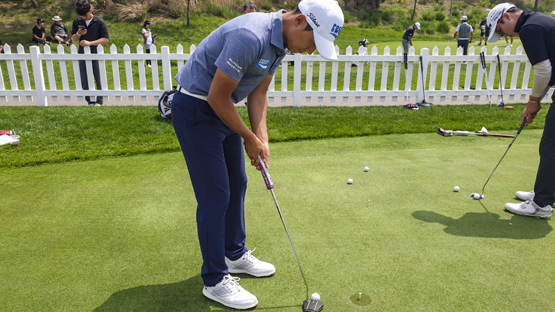 D.M. Lee and the practice green with his Phantom X 8.