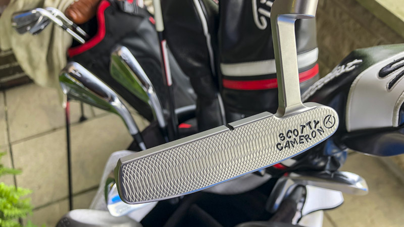009 Tour putter with a sight line on the topline and deep face milling.