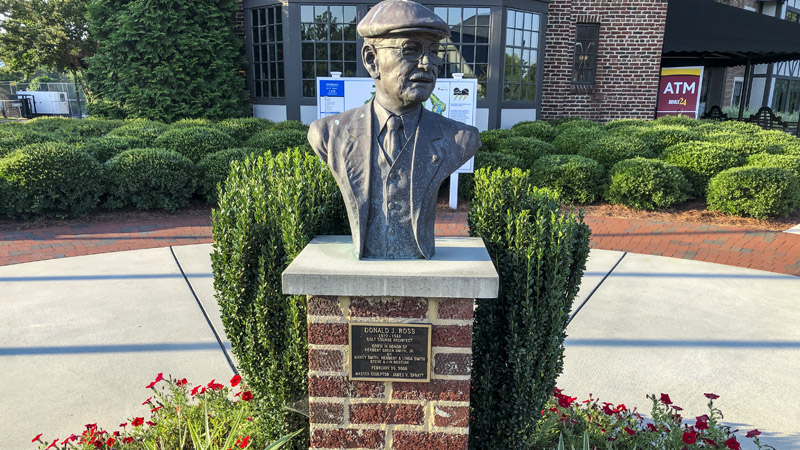 The bust of famous course designer Donald Ross sits outside the clubhouse at Sedgefield Country Club.