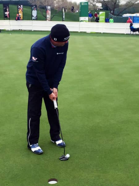 From one desert to another, Jason Dufner in rainy Phoenix with his title taking Futura X7M Prototype.