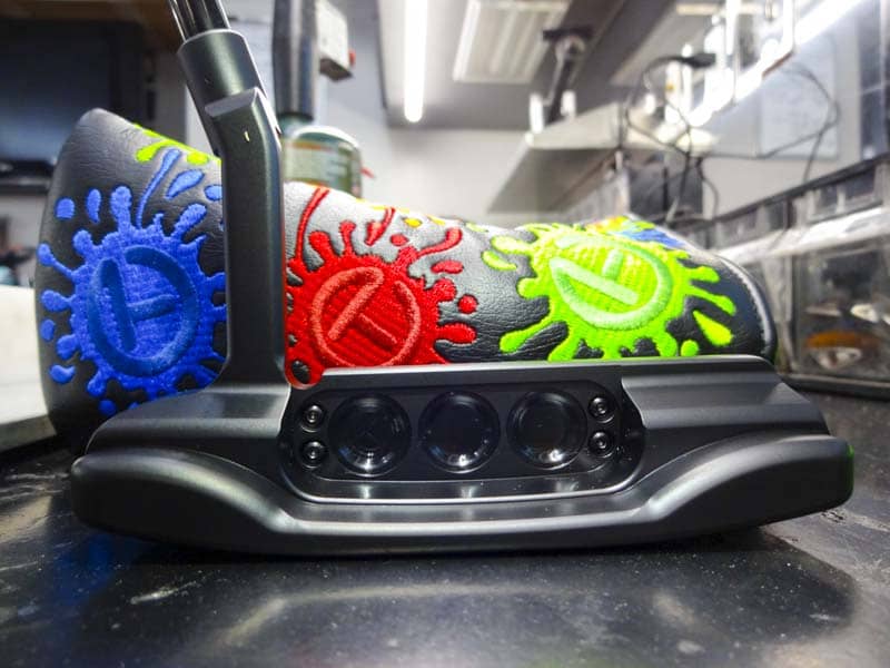 Stealthy black paintfill with a bright Paint Splash Circle T headcover.