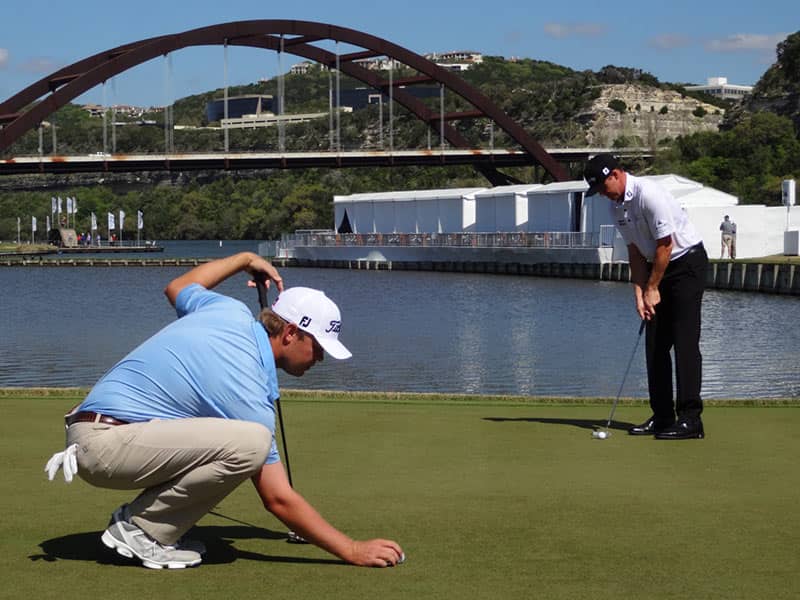 Titleist Brand Ambassador Patton Kizzire lining up a putt while Jimmy Walker practices in Austin.