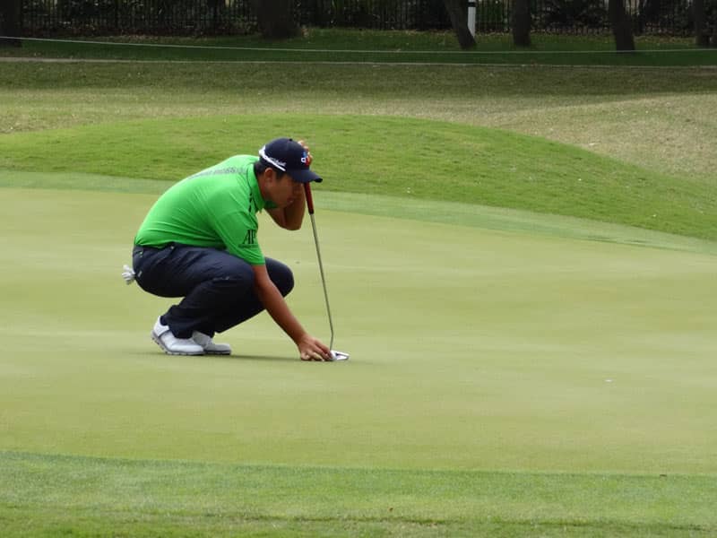 Titleist FPL player Ben An lines up a putt.