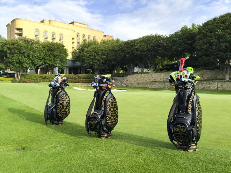 Look at those beautiful staff bags full of putters on the practice green.