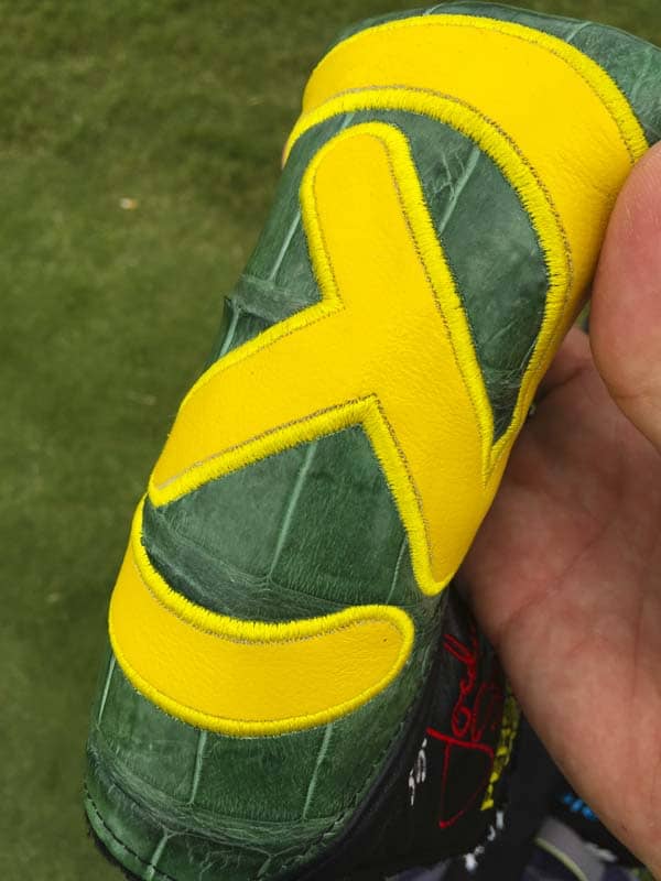 A vibrant Circle T on gator hide.