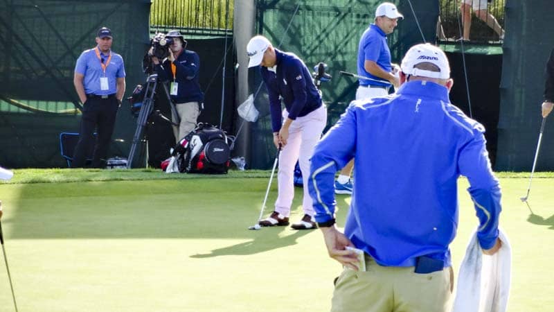 Justin Thomas on the practice green.