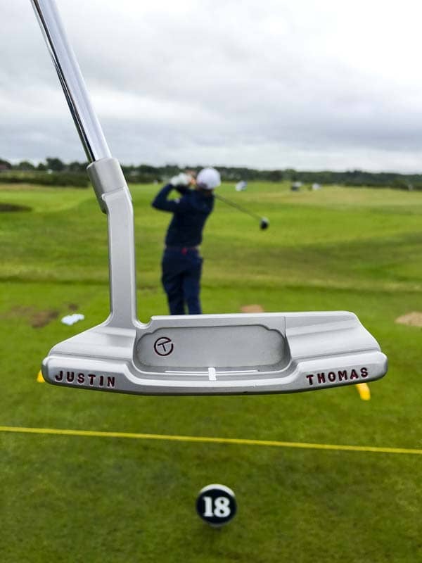 Titleist Brand Ambassador Justin Thomas framed on the range.
