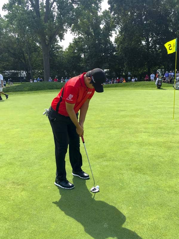 Putting his Futura X7M Tour putter through its paces.