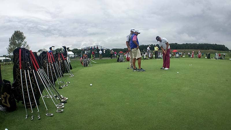 Titleist FPL player Erik Compton on the practice green.