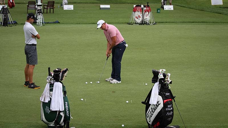 Titleist FPL player Scott Stallings on the putting green going through some drills.