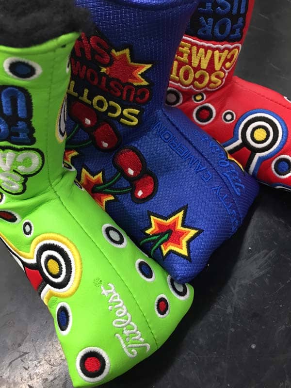 Crowned Industrial Circle T headcovers framing a Custom Shop Cherry Bomb headcover in blue.