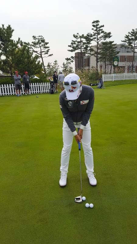On the practice green.