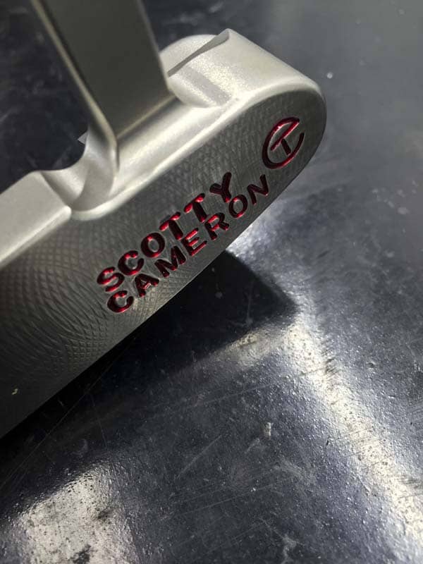 Milling marks on the face heel of a 009 Tour putter.