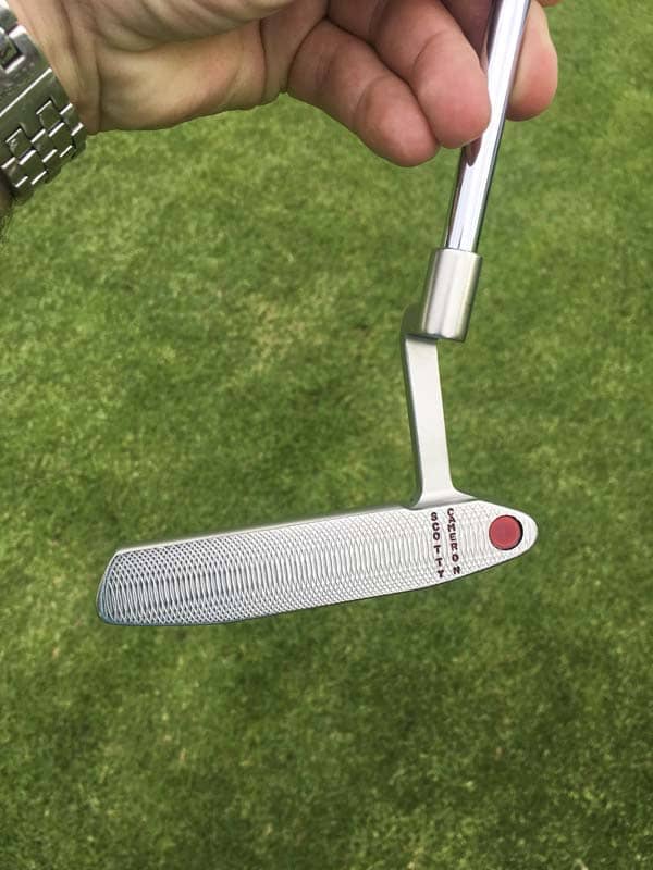 A vertical stamped Newport 2 GSS Tour putter.