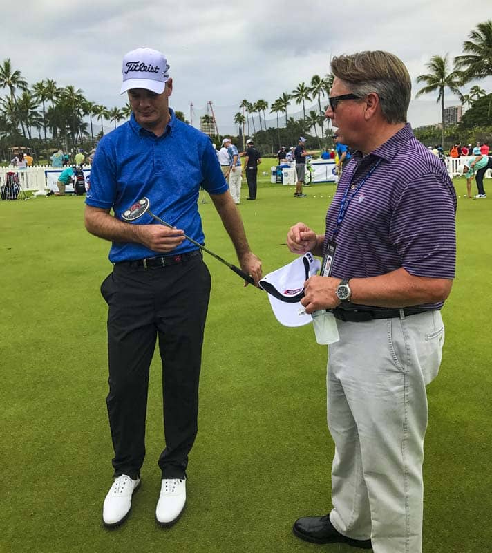 Scotty on the putting green with Tyrone van Aswegen at Waialae CC in Hawaii.