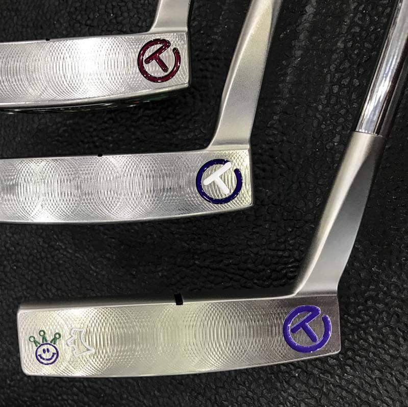 Heel-shafted Circle T Tour putters with varied stamps and paintfill.